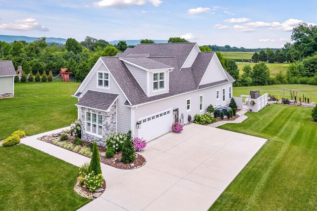 view of front facade featuring a garage and a front lawn