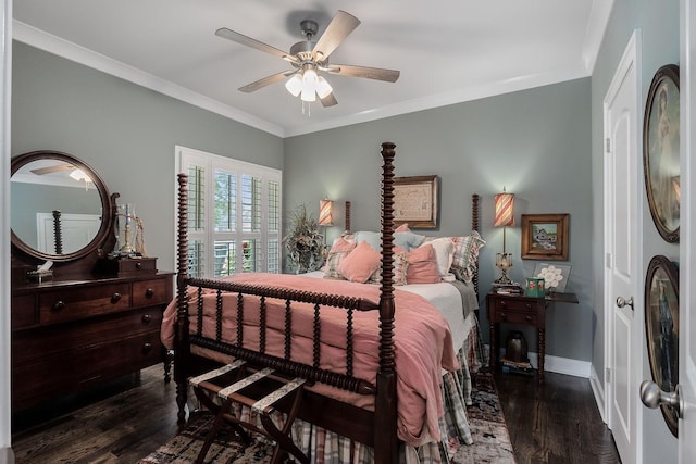 bedroom featuring dark wood-type flooring, ceiling fan, and ornamental molding