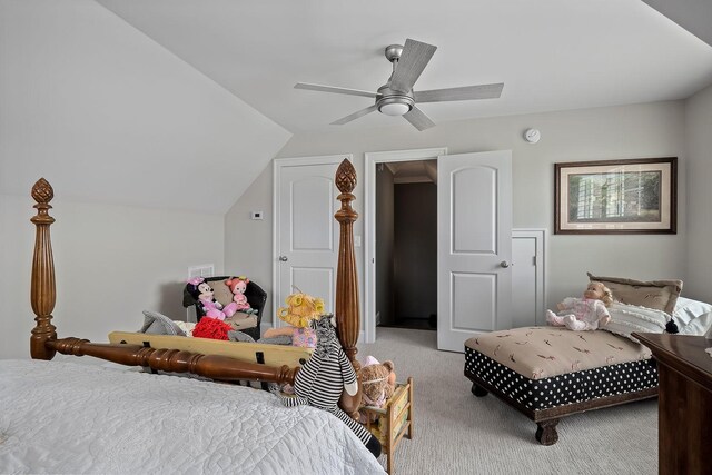 bedroom featuring ceiling fan, lofted ceiling, and light carpet