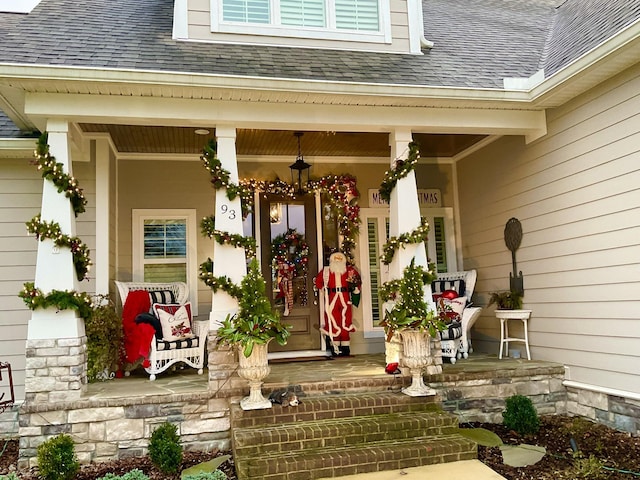 entrance to property featuring covered porch