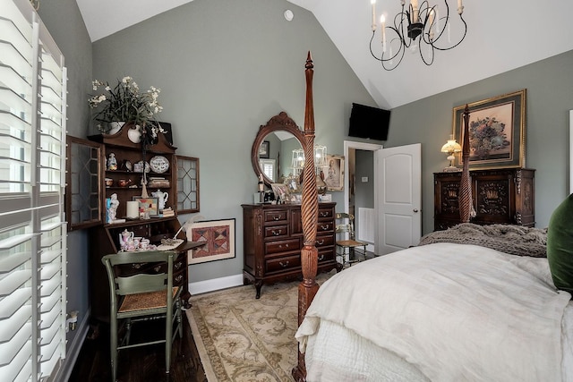 bedroom featuring a chandelier and high vaulted ceiling