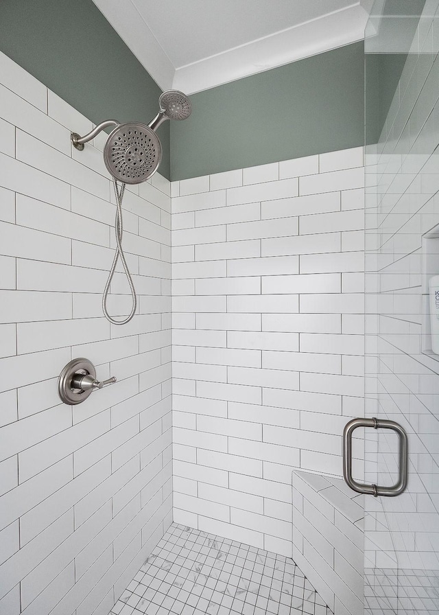 bathroom with tiled shower