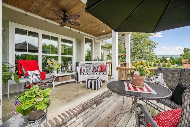 wooden deck with ceiling fan and an outdoor hangout area