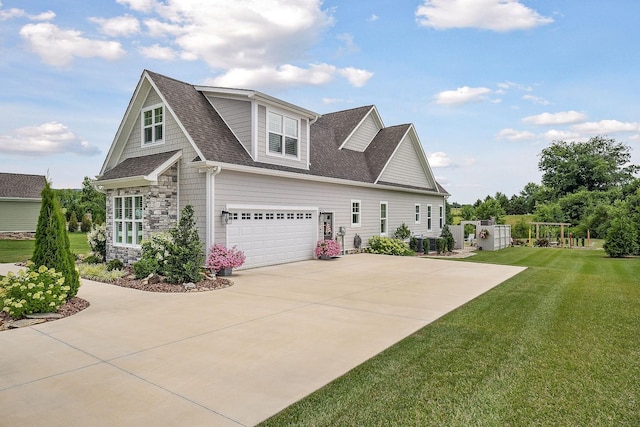 view of front of house featuring a garage and a front yard