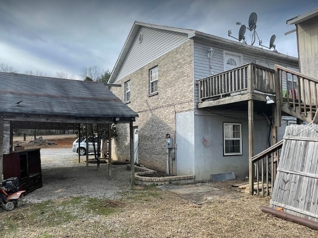 back of house with a balcony