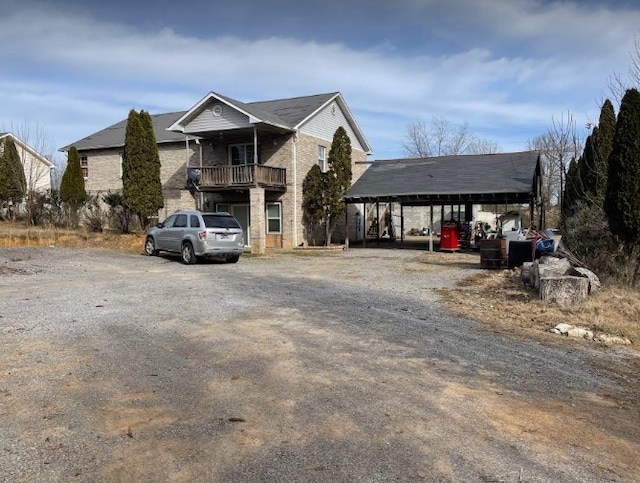 front facade with a carport