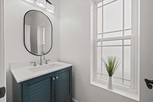 bathroom with vanity and a healthy amount of sunlight