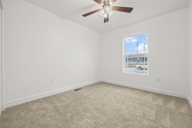 carpeted empty room with ceiling fan