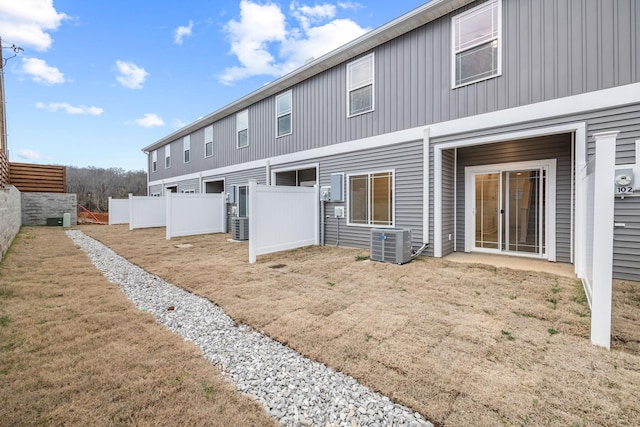 back of house featuring central AC