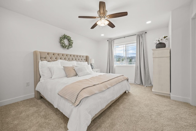 bedroom featuring ceiling fan and light carpet