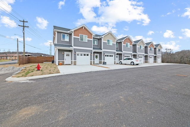 townhome / multi-family property featuring a garage