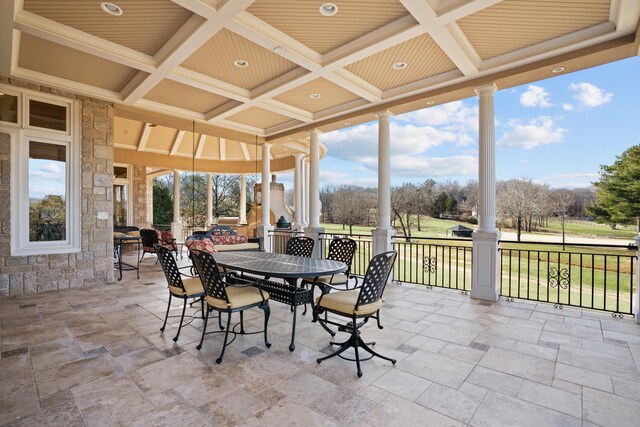 sunroom / solarium featuring beam ceiling and coffered ceiling