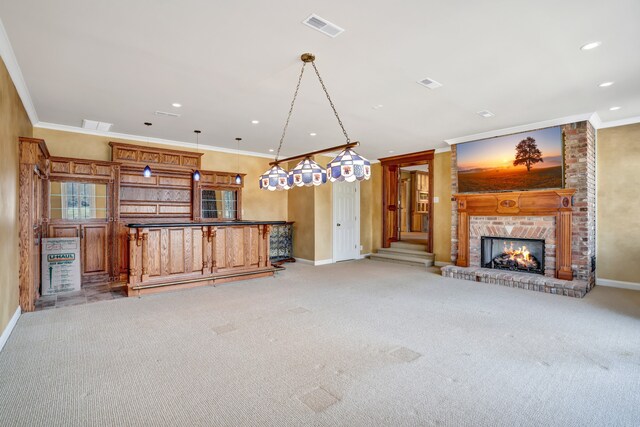 unfurnished living room featuring a dry bar, baseboards, visible vents, crown molding, and a fireplace