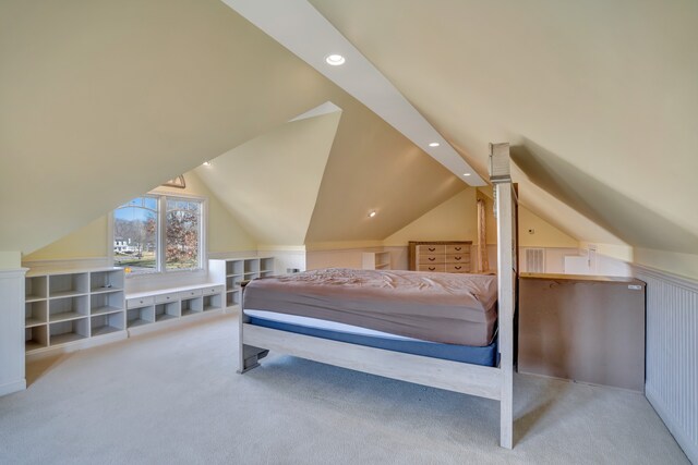 carpeted bedroom with vaulted ceiling and recessed lighting