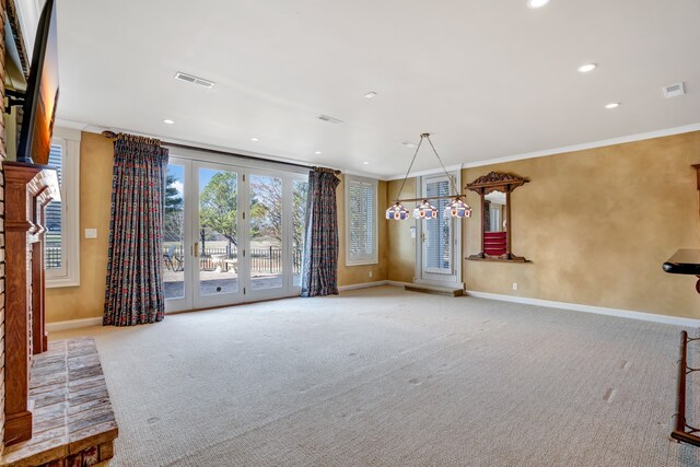 interior space with ornamental molding, visible vents, carpet floors, and baseboards