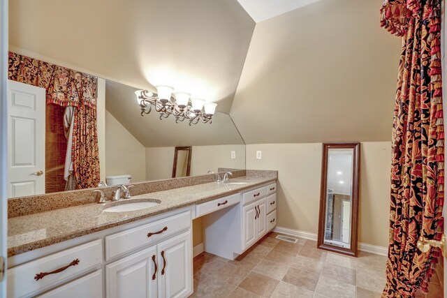 full bath with double vanity, visible vents, vaulted ceiling, and a sink