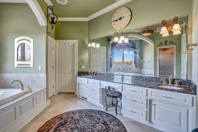 bathroom featuring double vanity, ornamental molding, a sink, and tile patterned floors