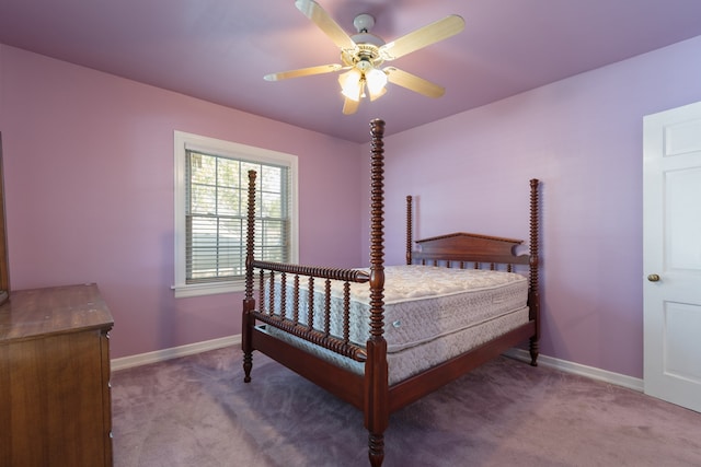 bedroom featuring ceiling fan and carpet