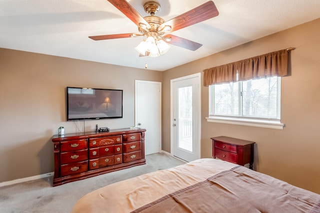 bedroom featuring ceiling fan and light carpet