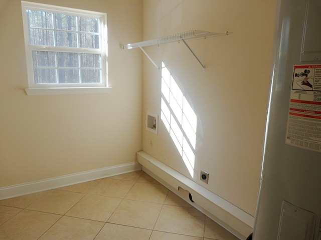 washroom featuring light tile flooring and electric dryer hookup