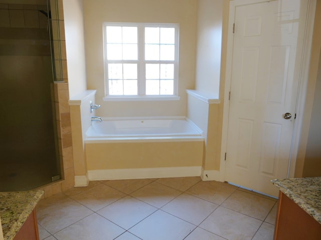 bathroom featuring separate shower and tub, tile floors, and vanity