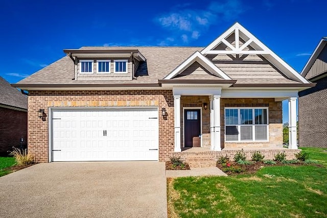 craftsman inspired home featuring a front yard and a garage