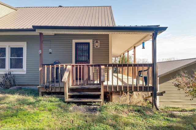 back of house with a deck