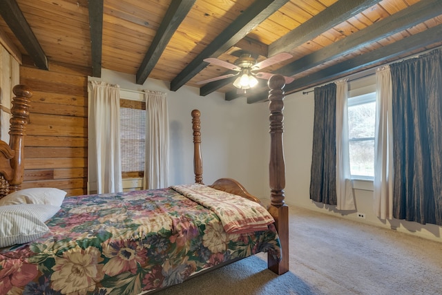 carpeted bedroom with beam ceiling, ceiling fan, and wooden ceiling