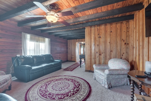 living room with light carpet, ceiling fan, and beamed ceiling