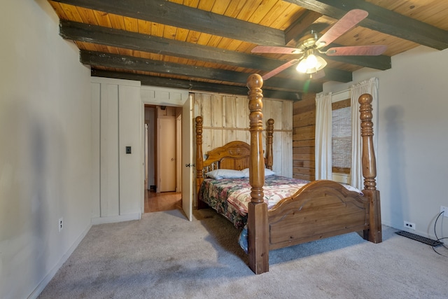 bedroom featuring light carpet, wooden ceiling, and beamed ceiling