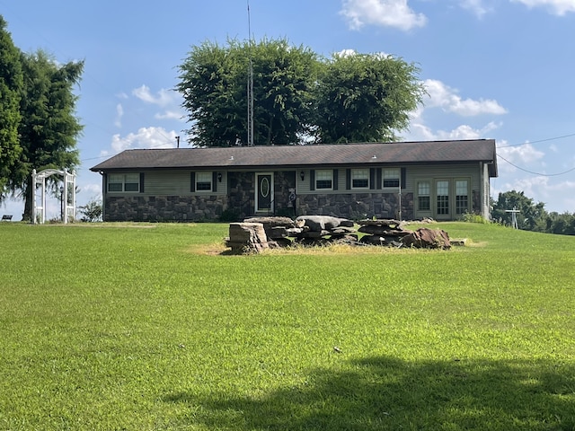 ranch-style home with a front lawn