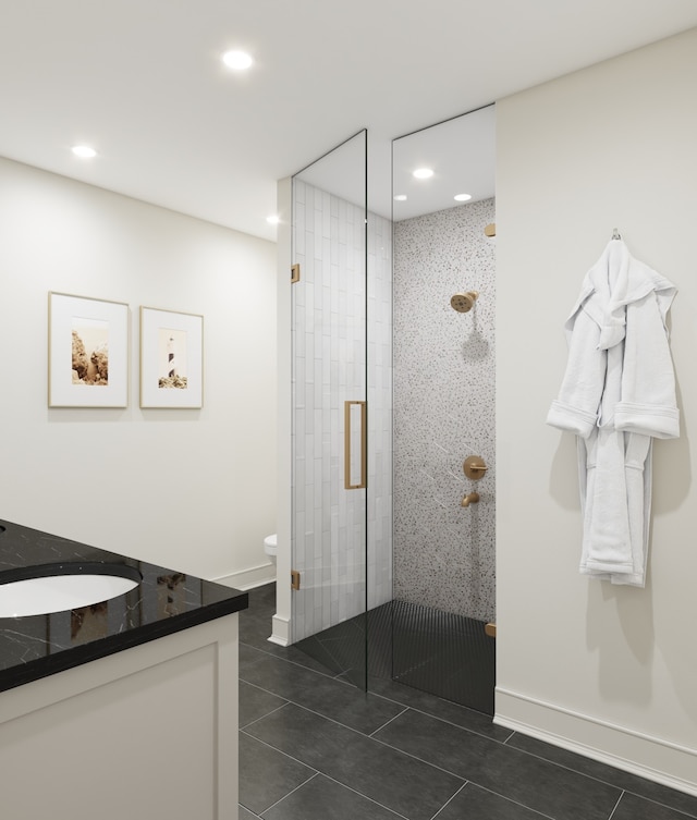 bathroom featuring tile floors, toilet, an enclosed shower, and vanity