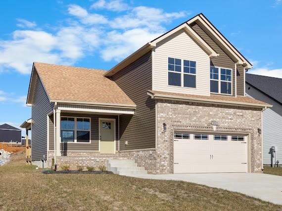 craftsman-style home with a garage and a front yard