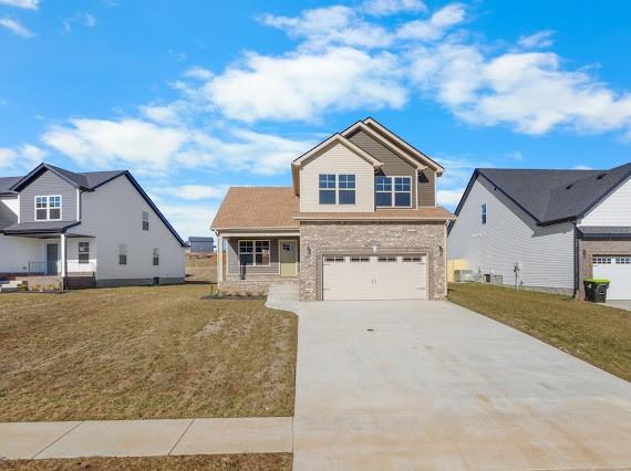 view of front of house with a front lawn and a garage