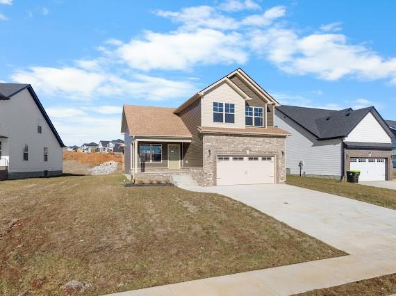 view of front facade featuring a garage and a front lawn