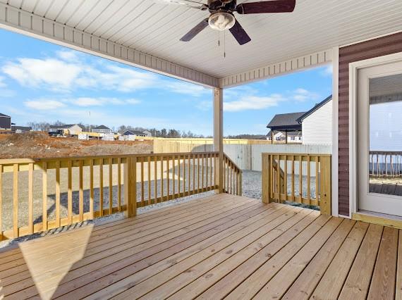 wooden deck featuring ceiling fan