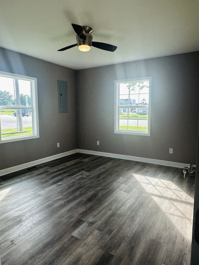 unfurnished room with ceiling fan, hardwood / wood-style flooring, and a healthy amount of sunlight