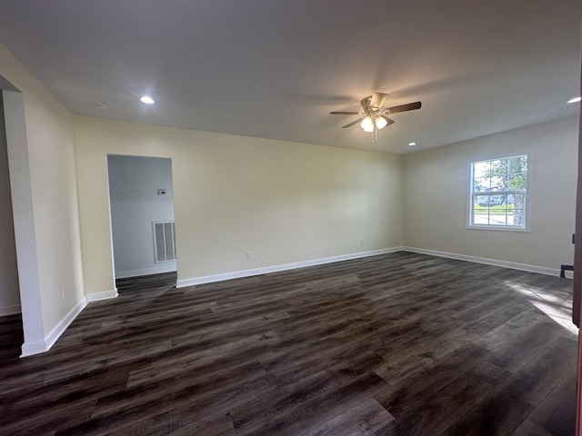 unfurnished room with ceiling fan and dark hardwood / wood-style floors