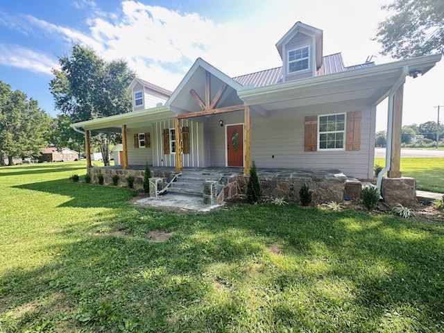 view of front of home featuring covered porch and a front yard