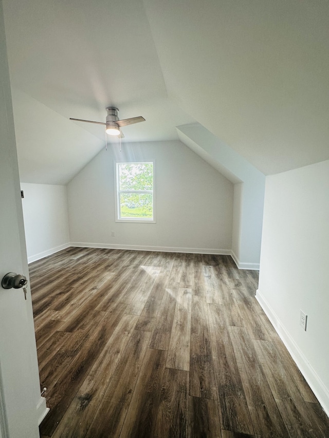 bonus room featuring ceiling fan, dark wood-type flooring, and vaulted ceiling