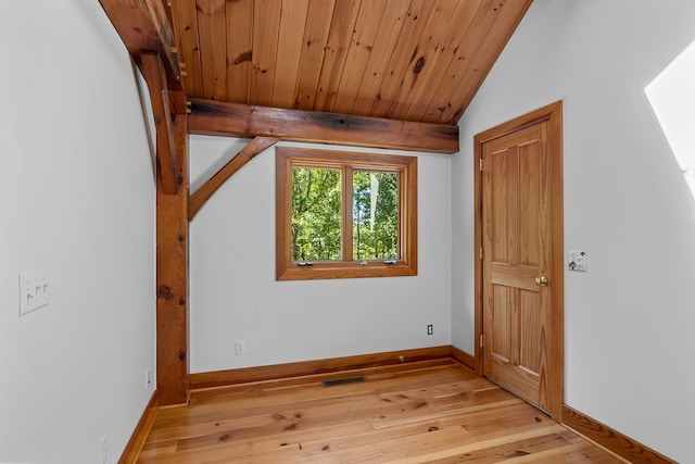 additional living space featuring lofted ceiling and light hardwood / wood-style flooring