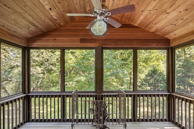 unfurnished sunroom with vaulted ceiling, wooden ceiling, and ceiling fan