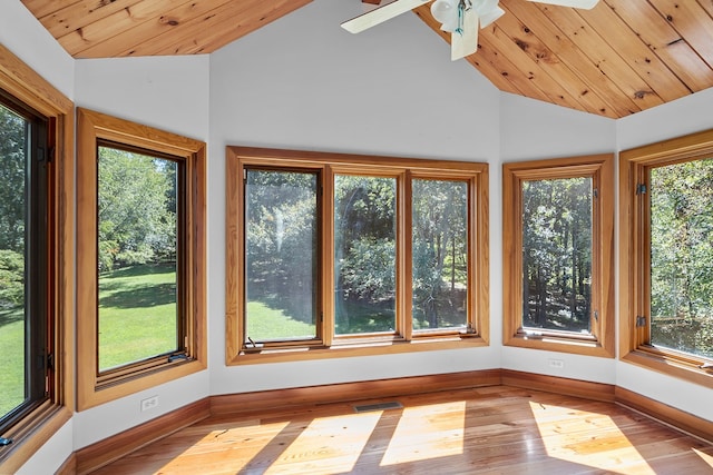 unfurnished sunroom with lofted ceiling, wooden ceiling, and ceiling fan