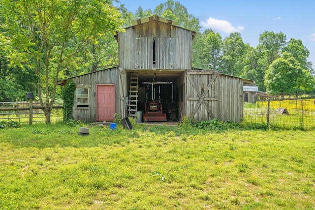 view of outdoor structure with a lawn