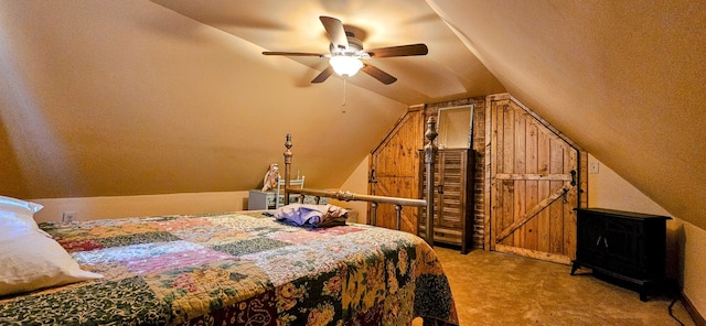 carpeted bedroom featuring lofted ceiling and ceiling fan