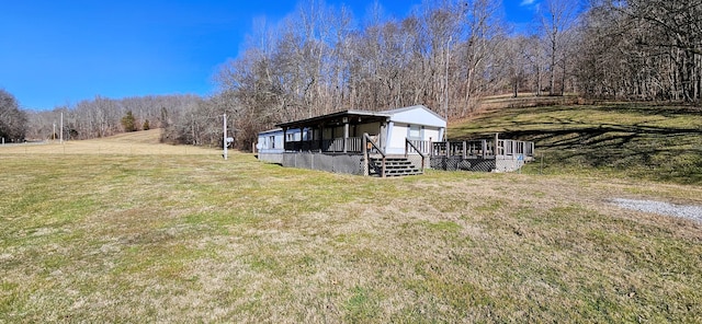 view of yard featuring a deck