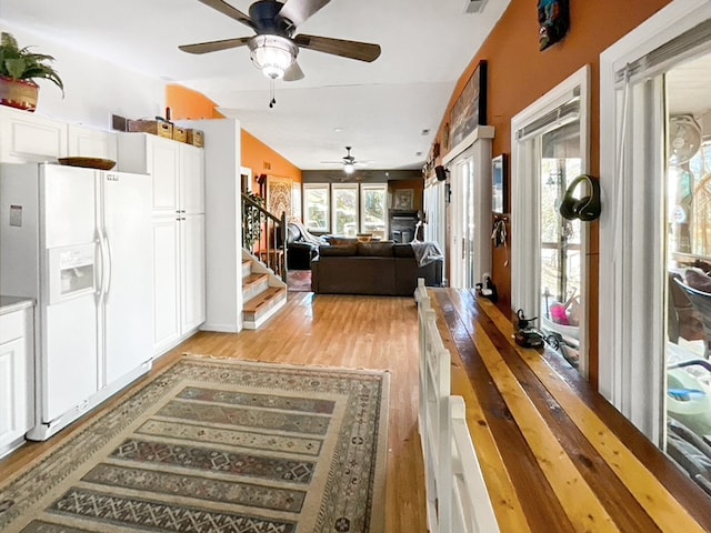 interior space featuring ceiling fan and lofted ceiling