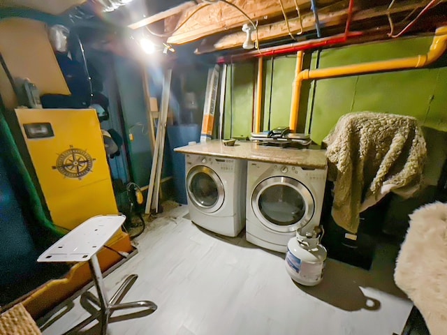 laundry area with independent washer and dryer