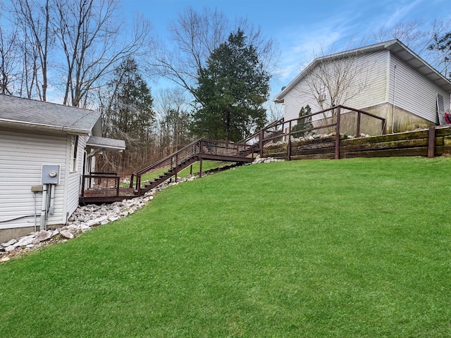 view of yard featuring a wooden deck