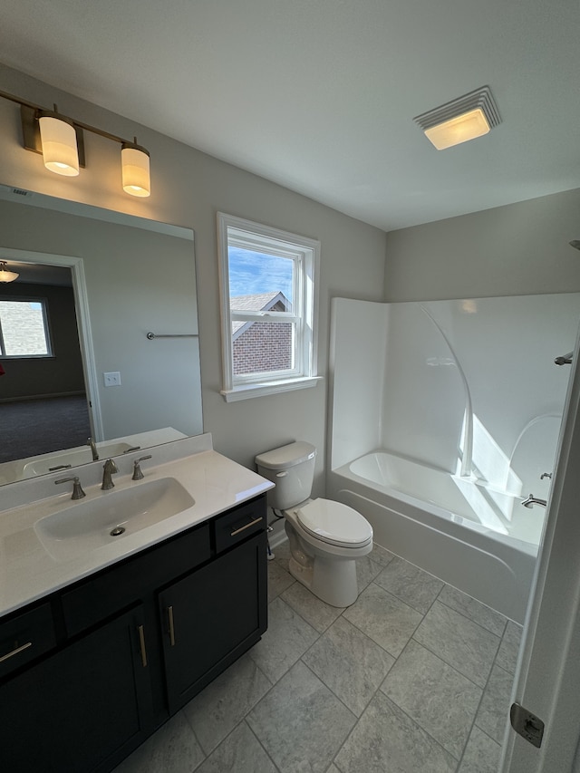 full bathroom featuring vanity, toilet, and shower / washtub combination